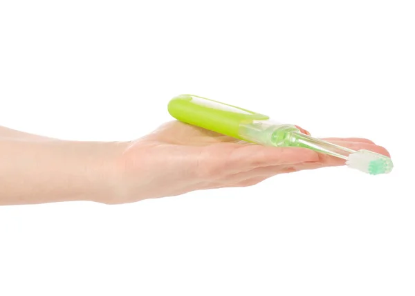 緑の歯ブラシを手に旅行します。 — ストック写真