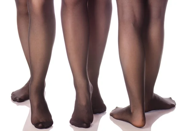 Γυναικεία πόδια σε μαύρο οπάκ καλσόν κάλτσες από διαφορετικές κατευθύνσεις ομορφιά — Φωτογραφία Αρχείου