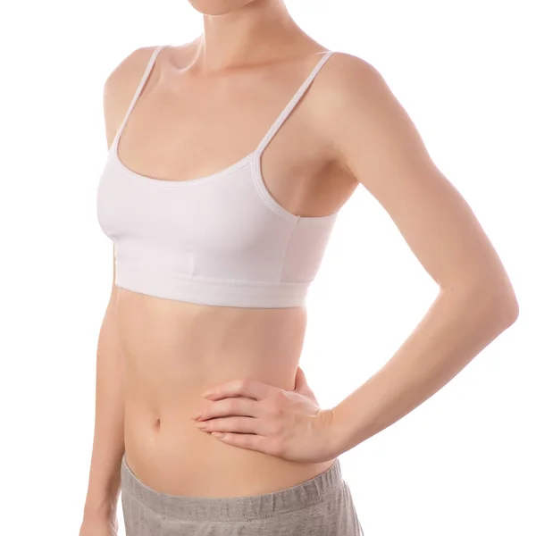 Mooie jongedame in witte T-shirt boven hand op hip kant maag schoonheid geneeskunde — Stockfoto
