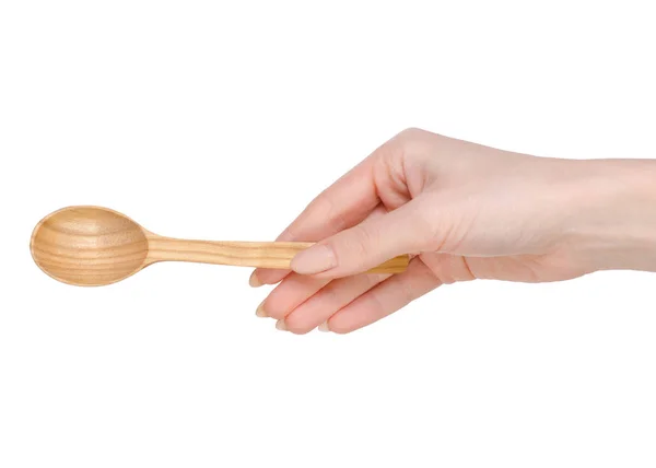Wooden spoon in hands — Stock Photo, Image