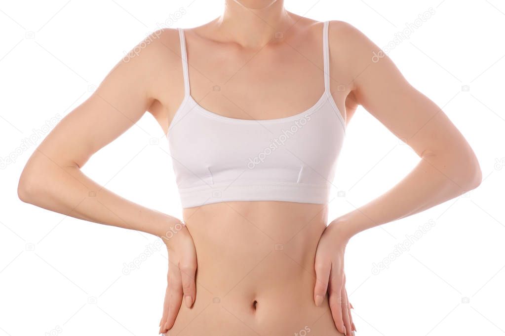 Young beautiful woman in white t-shirt top bra hand on waist belly health beauty
