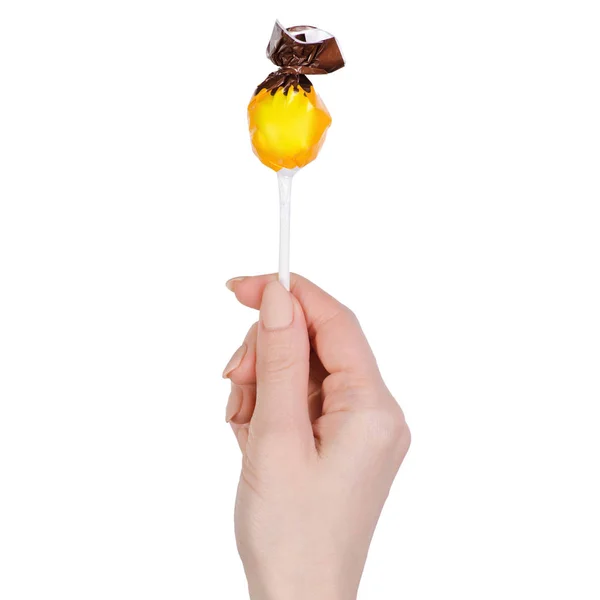 Lolipop na mão no isolamento fundo branco — Fotografia de Stock