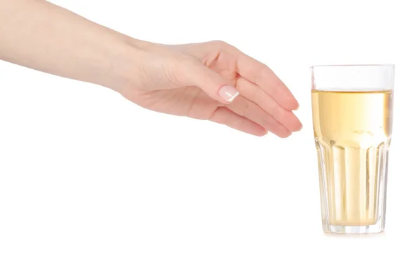 A glass of apple juice in hand — Stock Photo, Image