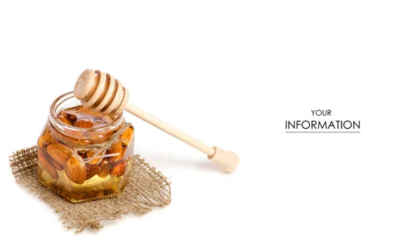 Un borcan de miere cu o lingură pentru modelul migdalelor cu nuci de miere — Fotografie, imagine de stoc