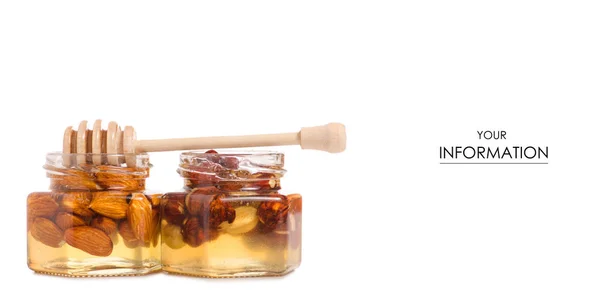 Un tarro de miel con una cuchara para el patrón de nueces de miel — Foto de Stock