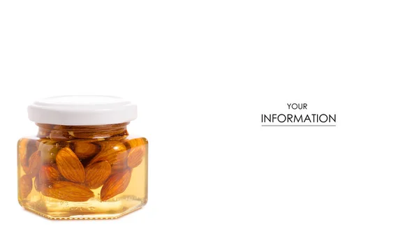 En honung burk med mandel nötter mönster — Stockfoto