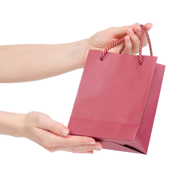 Paquete de bolsa roja de cartón en la mano — Foto de Stock