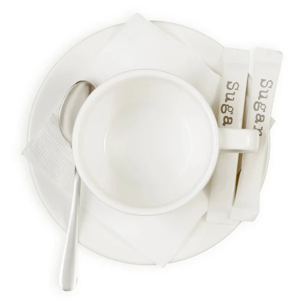 Біла чашка і ложка цукрових паличок для тарілок — стокове фото