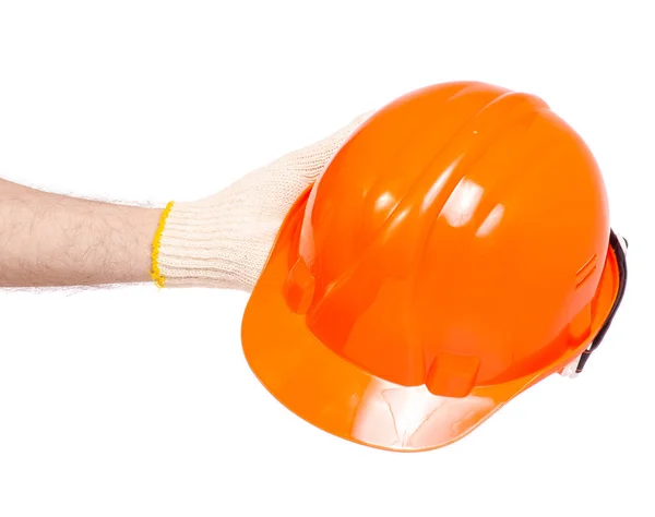 Orange man's helmet man's hand in a glove — Stock Photo, Image