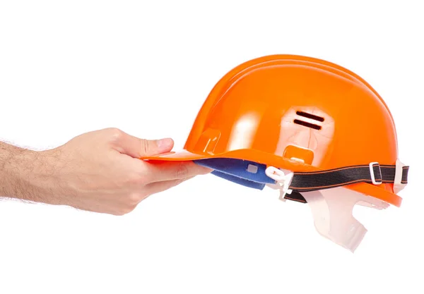 Oranje man helm in mannenhand — Stockfoto