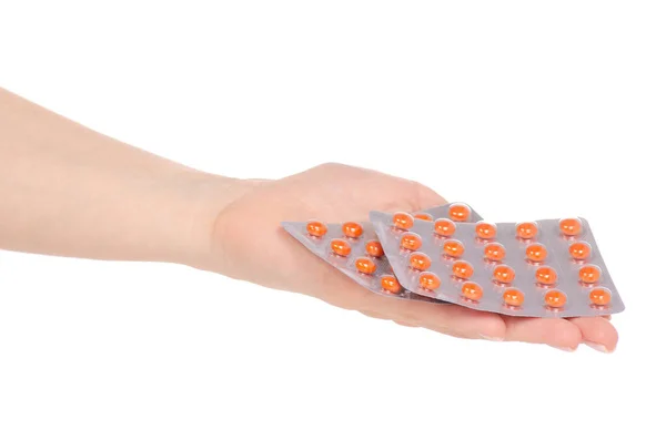 ブリスター薬で錠剤を保持している女性の手 — ストック写真
