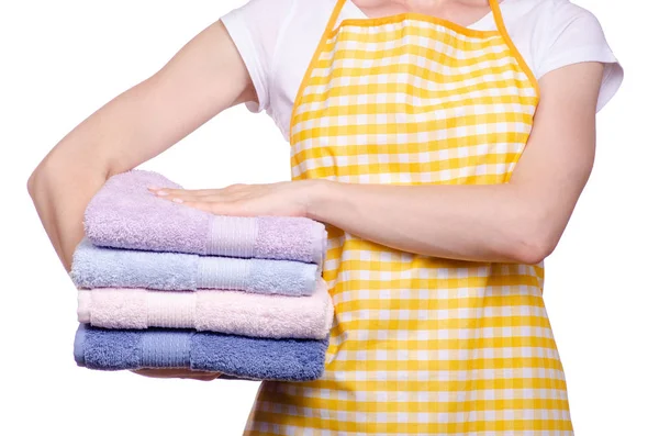 Vrouw in schort in handen stapel handdoeken Stockfoto