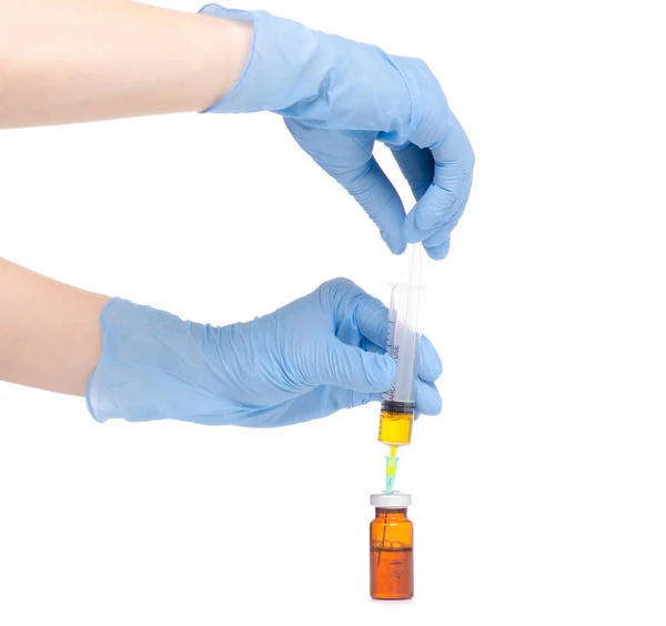 Jeringa y ampolla médica en guantes médicos de mano — Foto de Stock