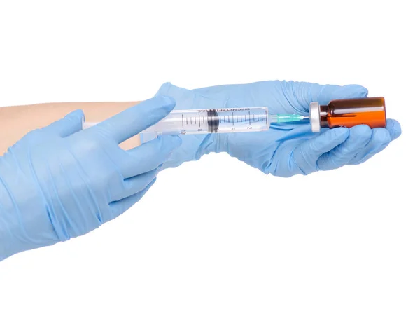 Spritze und medizinische Ampulle in der Hand medizinische Handschuhe — Stockfoto