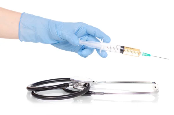 Stethoscope syringe in the hands of medical gloves — Stock Photo, Image
