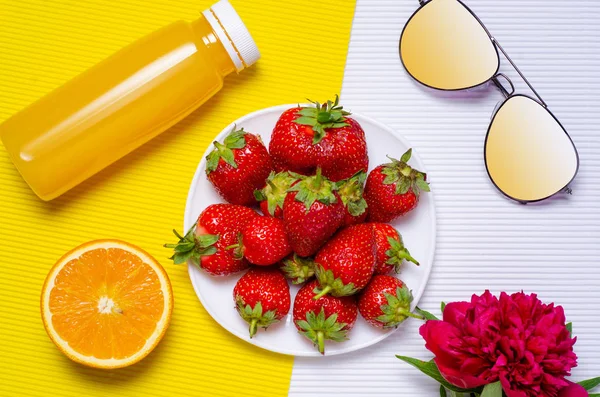 Strawberry flowers peonies orange bottle juice sunglasses