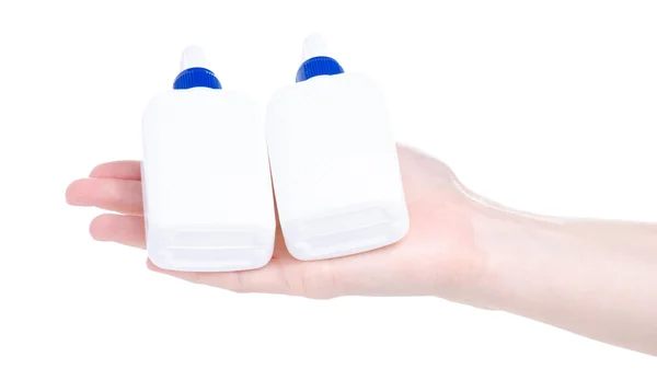 Белый бутылочный клей в руке — стоковое фото