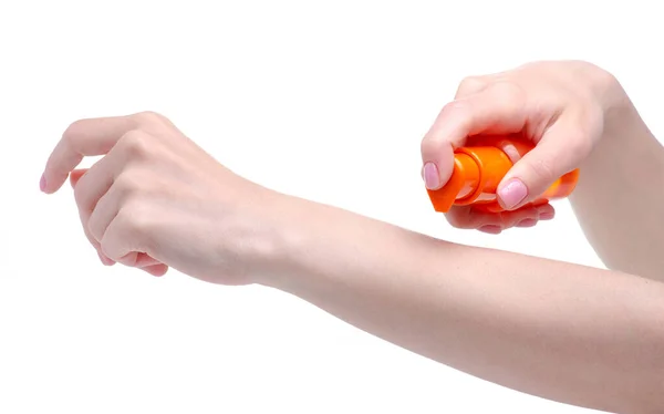 Orange sunscreen suntan bottle in hand — Stock Photo, Image