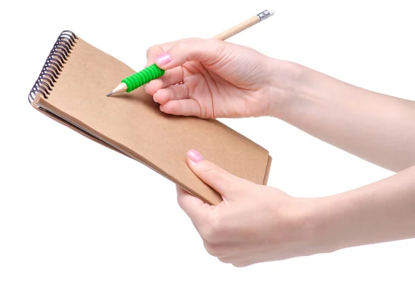 Notepad and pencil in hand Stock Photo