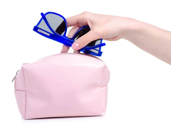 Blue sunglasses put in pink cosmetic bag — Stock Photo, Image