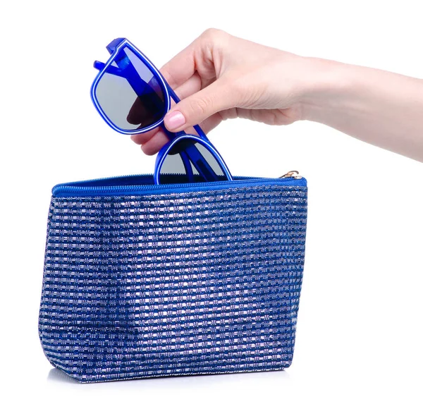 Blue sunglasses put in blue cosmetic bag — Stock Photo, Image