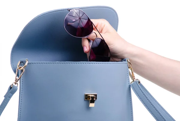 Sunglasses put in blue bag — Stock Photo, Image