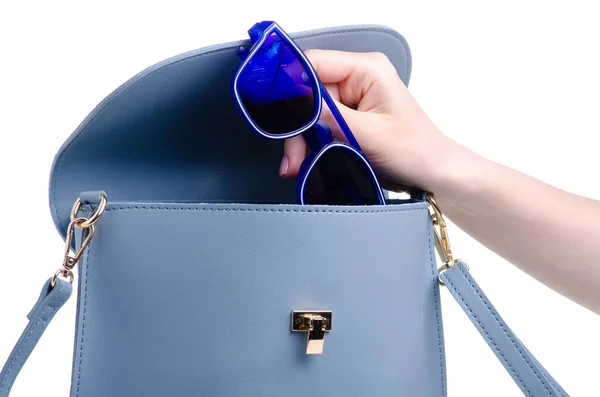 Blue sunglasses put in blue bag — Stock Photo, Image