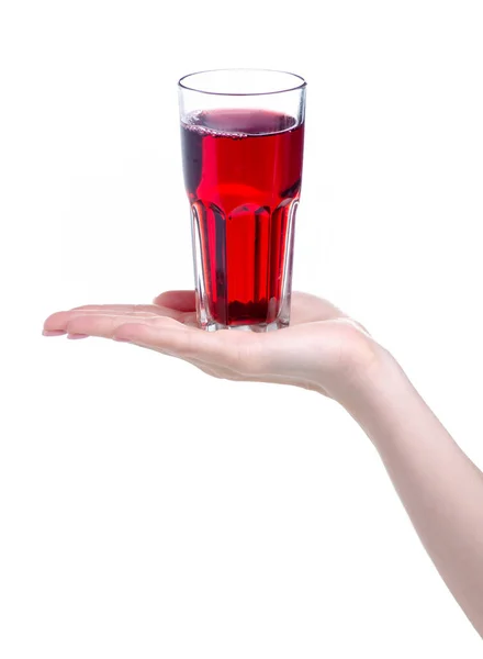 Cherry juice in a glass in hand — Stock Photo, Image