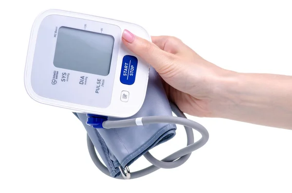 Monitor digital de presión arterial tonómetro eléctrico en la mano — Foto de Stock