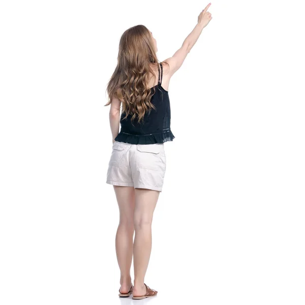 Mulher de shorts em pé olhando mostrando apontando — Fotografia de Stock