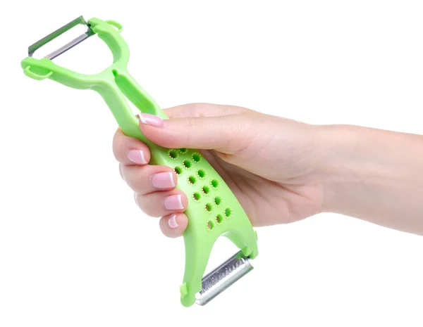 Peeler for vegetables in hand — Stock Photo, Image