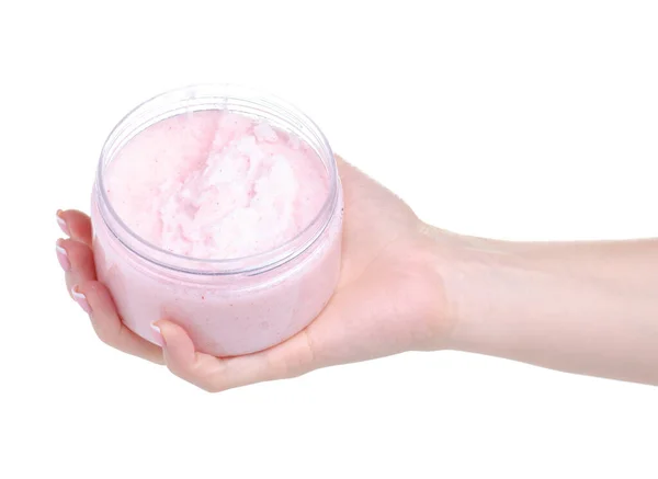 Frasco de exfoliante rosa para el cuerpo en la mano — Foto de Stock