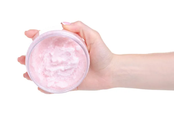Frasco de exfoliante rosa para el cuerpo en la mano — Foto de Stock