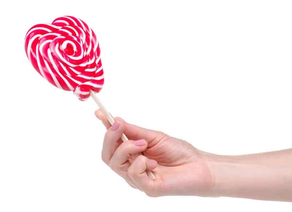 Candy lollipop heart in hand — Stock Photo, Image