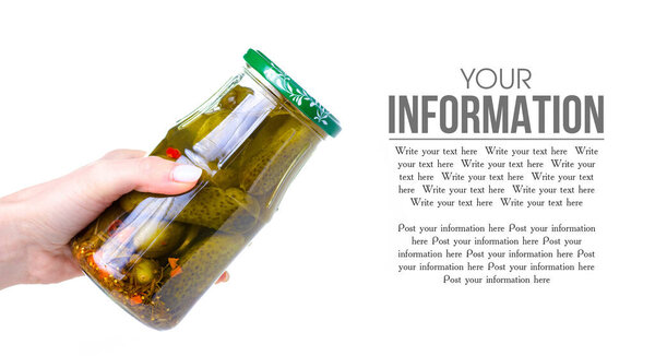 Jar of cucumbers pickles in hand