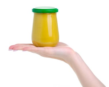 Bir elde cam kavanoz hardal