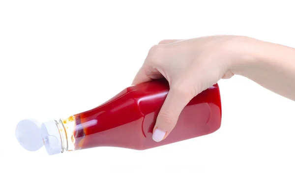 Ketchup em garrafa de plástico na mão — Fotografia de Stock