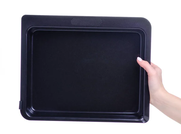 Black empty baking dish in hand — Stock Photo, Image