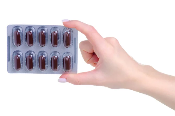 Blister comprimidos marrons cápsulas na farmácia medicina mão — Fotografia de Stock