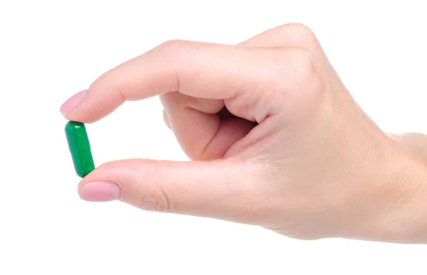 Pillole verdi capcule medicina farmaseo in mano — Foto Stock