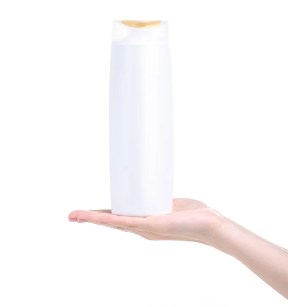 White bottle shampoo in hand — Stock Photo, Image