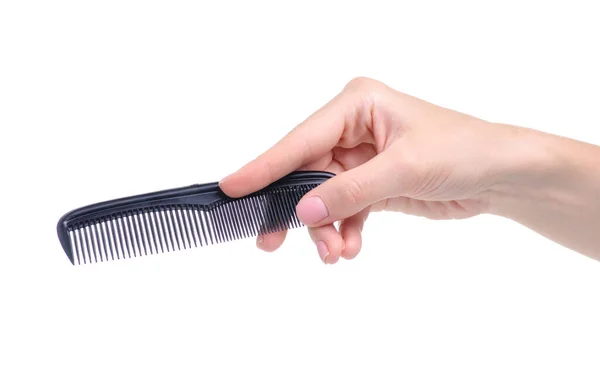 Black hair comb in hand — Stock Photo, Image