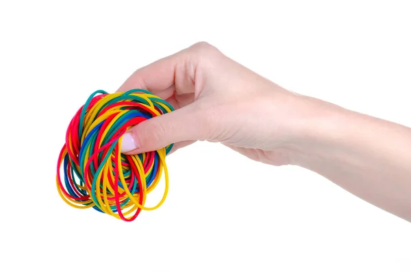 Stationery multicolored rubber bands in hand — Stock Photo, Image