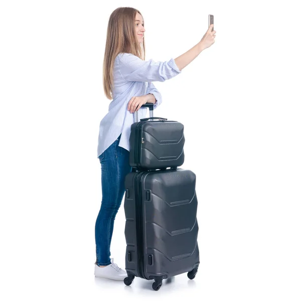 Woman with travel suitcase smiling selfie on smartphone — Stock Photo, Image