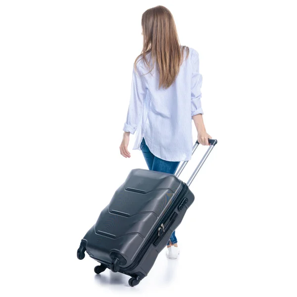 Woman with travel suitcase goes walking smiling — Stock Photo, Image