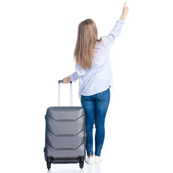 Mulher com mala de viagem em pé olhando mostrando apontando — Fotografia de Stock