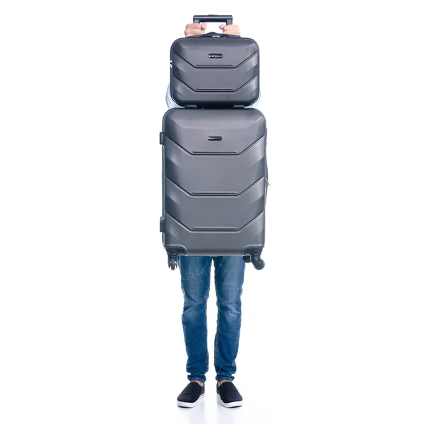 Man in jeans holding travel suitcase standing — Stock Photo, Image