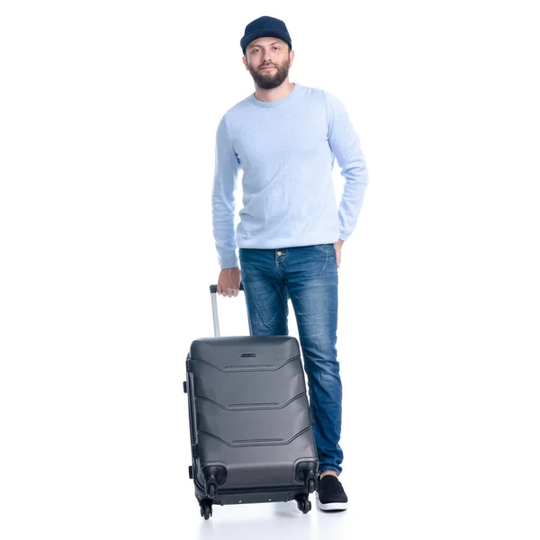 Mann in Jeans mit Reisekoffer steht — Stockfoto