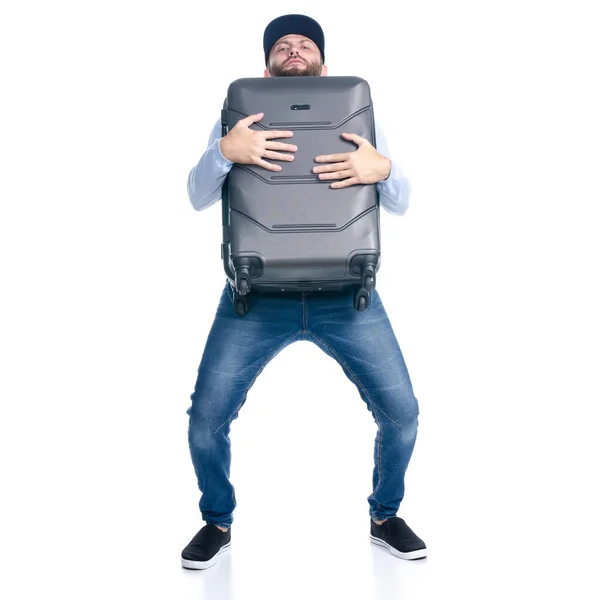 Kot pantolonlu bir adam seyahat çantası tutuyor. — Stok fotoğraf