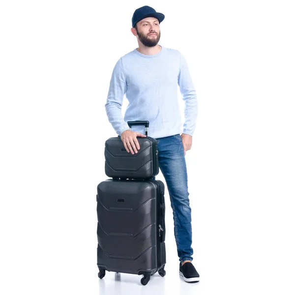 Uomo in jeans con valigia da viaggio in piedi — Foto Stock